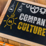 Company Culture written with graphics on blackboard